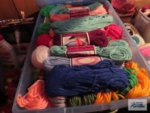 lot of crocheting supplies and totes