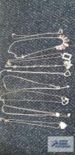 Silver colored costume jewelry necklaces