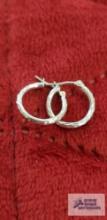 Silver colored hoop earrings, marked 14K Israel, approximate total weight is .82 G