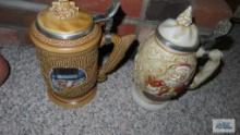 Two Avon Christmas steins