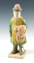 7 3/4" tall Chinese male figure from the Tang Dynasty, cira A.D 618- 907. In excellent condition.