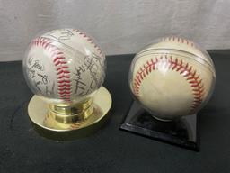 Pair of Signed Baseballs in plastic holders, Seattle Mariners 1990s &