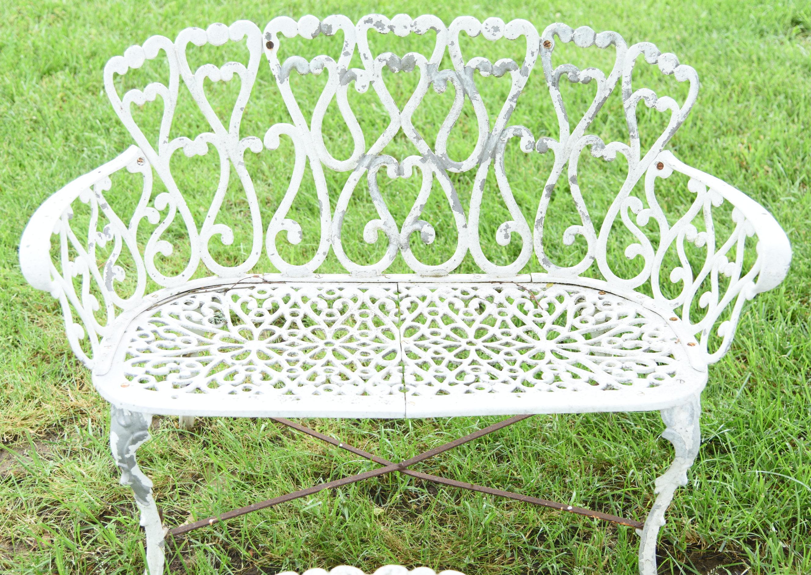 Lot #353 - White 4pc cast iron garden set to include: settee, two chairs and table