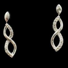 Pair of estate sterling silver diamond earrings