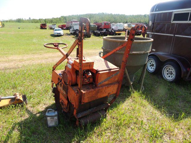 Essick walk behind rolling drum vibrator with Wisconsin gas engine