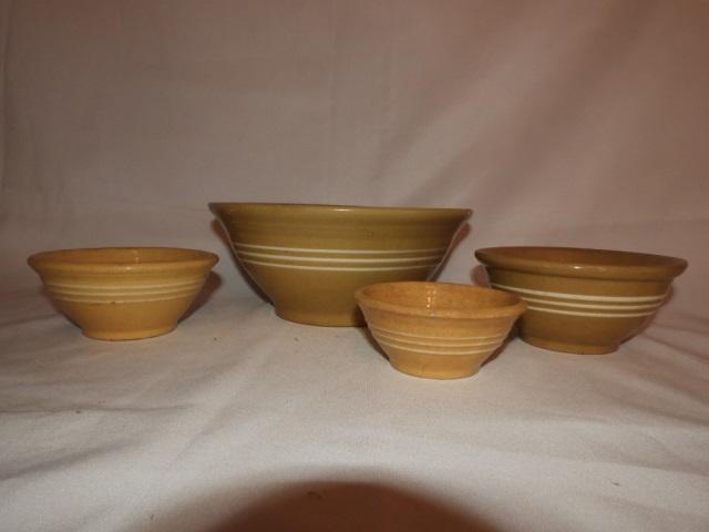 4 yellow ware bowls, 9 1/2", 6", 5 1/2" & 4 1/2"