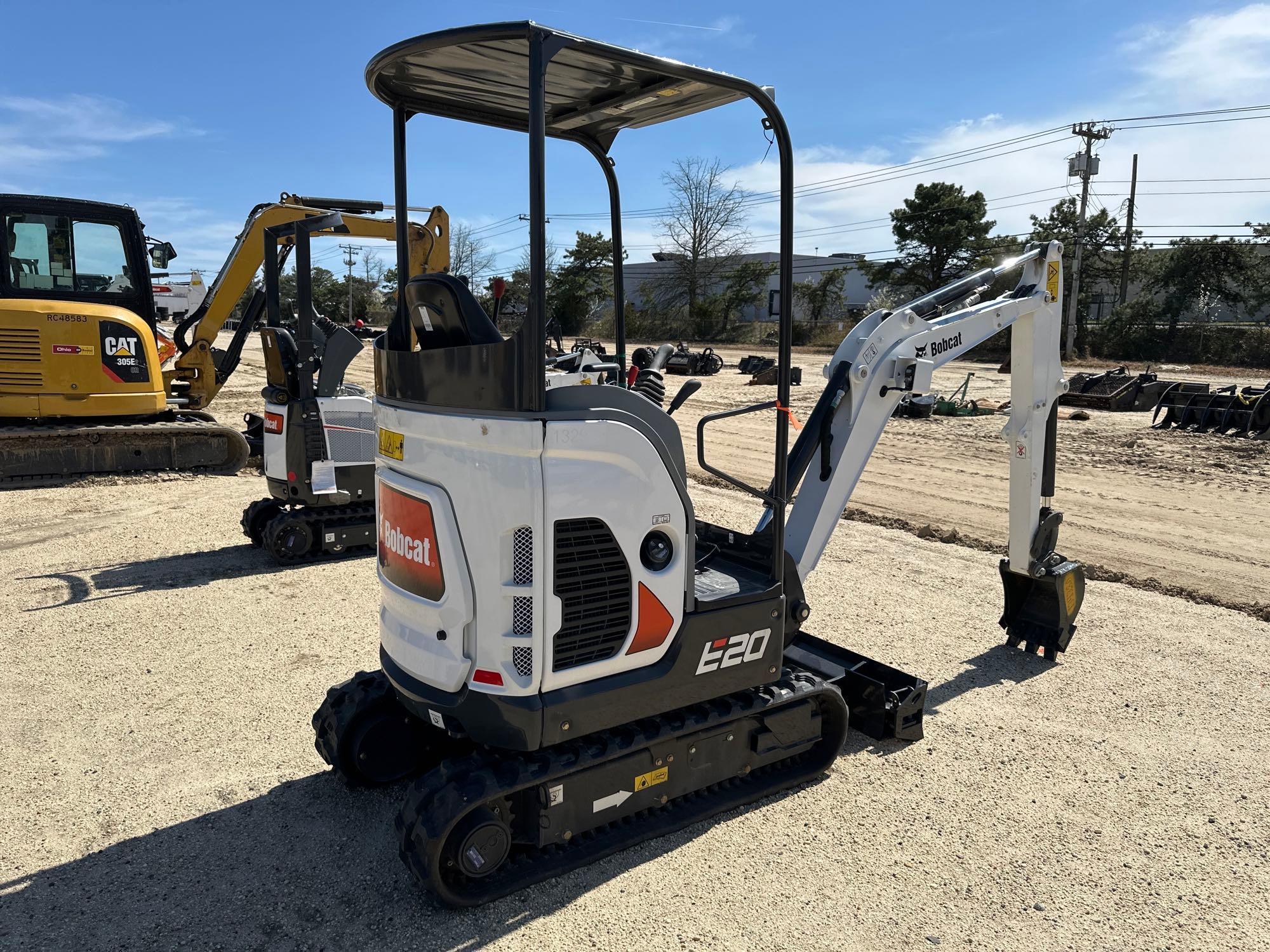 2023 BOBCAT E20 HYDRAULIC EXCAVATOR powered by diesel engine, equipped with OROPS, front blade,