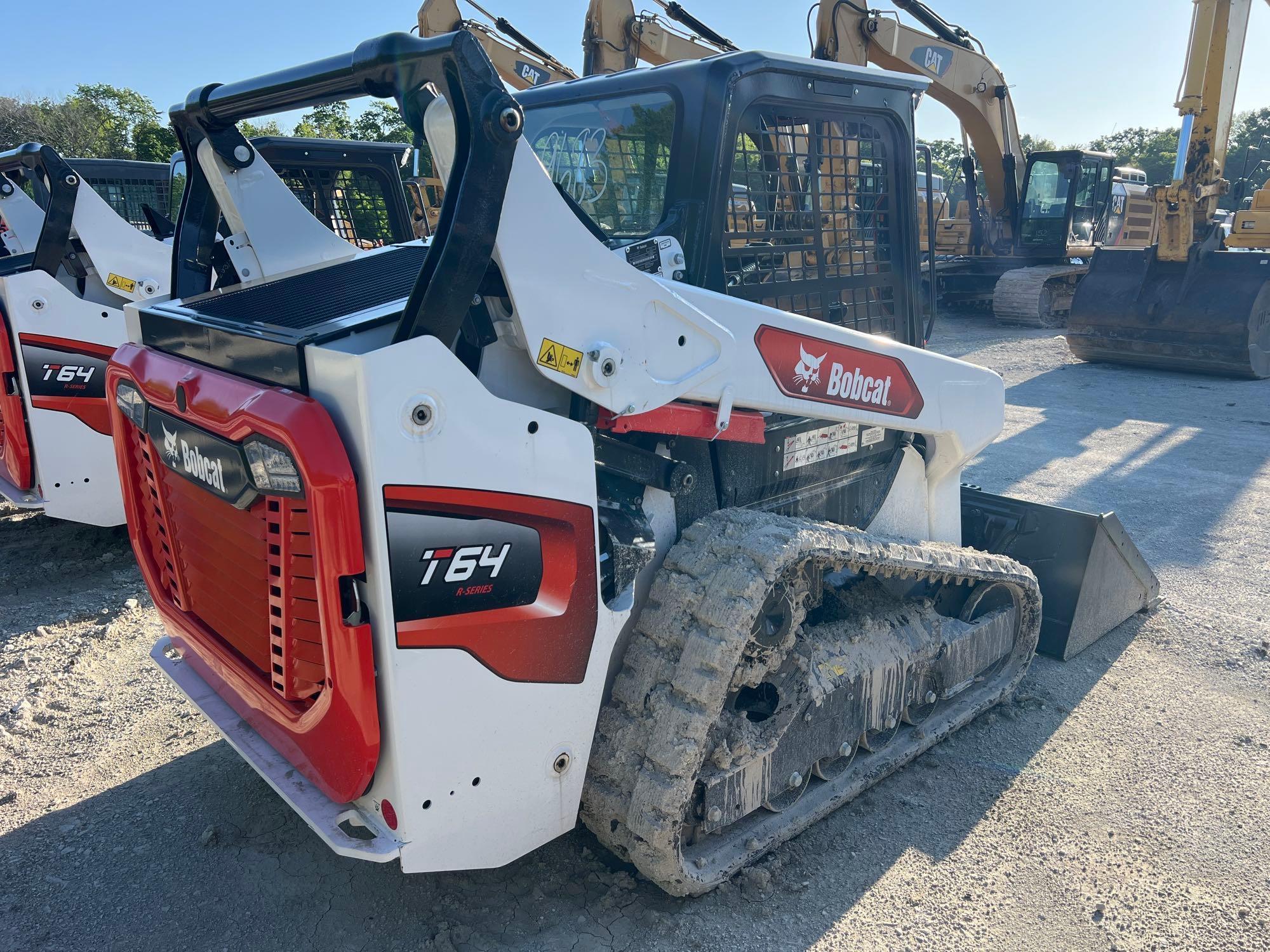 2023 BOBCAT T64 RUBBER TRACKED SKID STEER powered by diesel engine, equipped with rollcage,