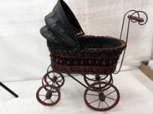 VINTAGE WICKER DOLL CARRIAGE 24" TALL 25"LONG WITH HANDLE PICK UP ONLY.