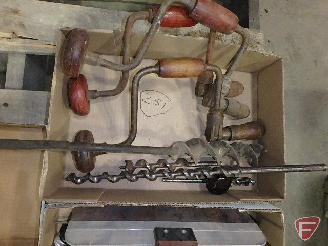 Brace drills, old wrenches, oiler, file, ball oil jar, and grinder