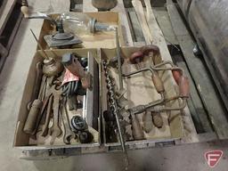 Brace drills, old wrenches, oiler, file, ball oil jar, and grinder