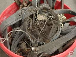 Large plastic bucket of leather horse harness