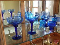 Blue glass vases, stemware, and votive holders, mugs, and brass figurines, candle holders,