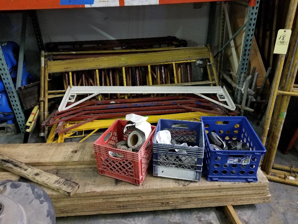 Large Pile of Scaffolding with Caster Wheels and Wood Boards