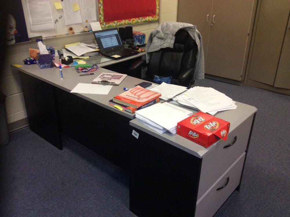 Teacher's desk, side cabinet and chair. Contents not included