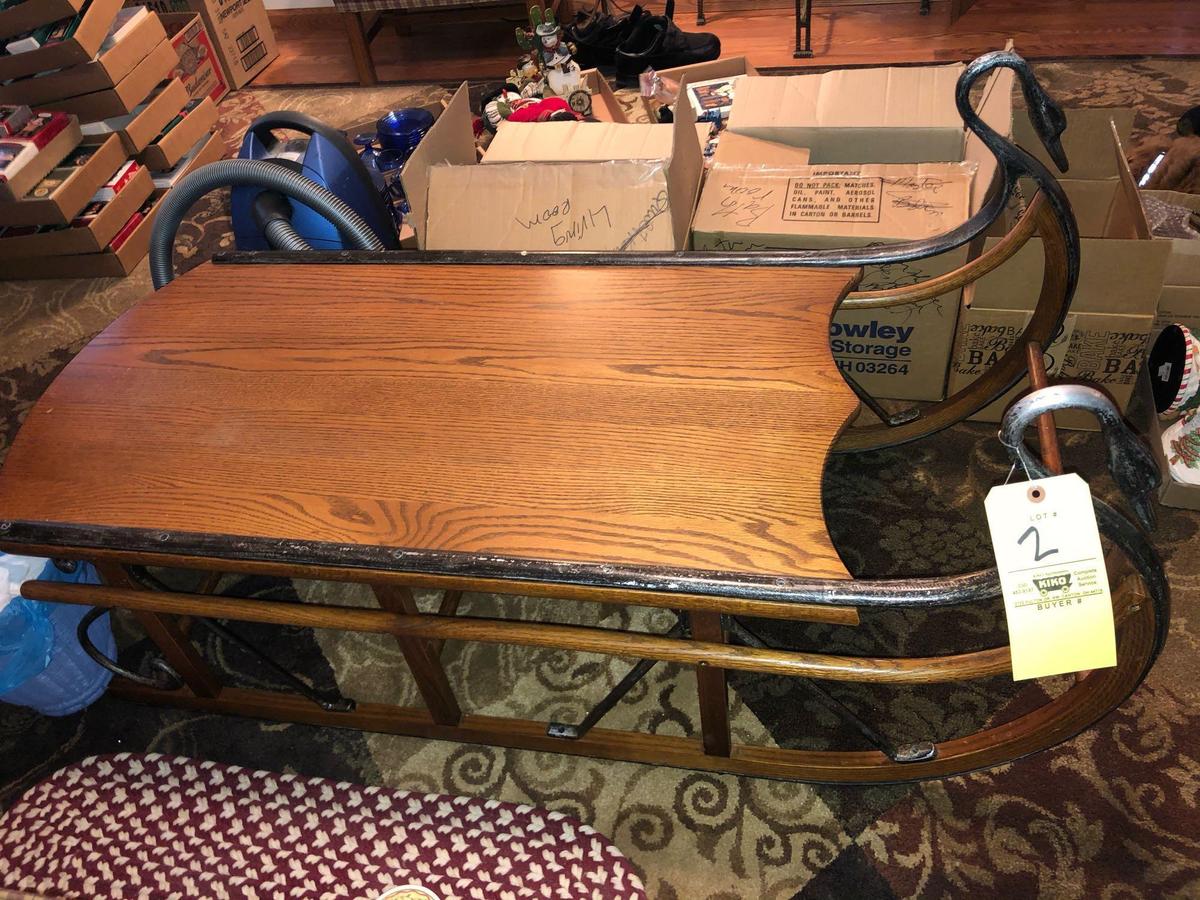 Sleigh style oak coffee table 56" L