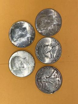 Five silver half dollars.