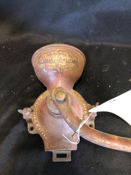 Block plane, wood pulley, early coffee mill, cast trivets