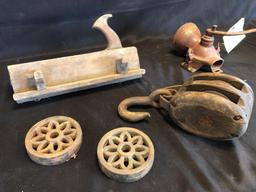 Block plane, wood pulley, early coffee mill, cast trivets