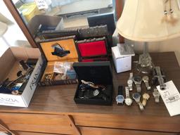 Men's watches and costume jewelry.