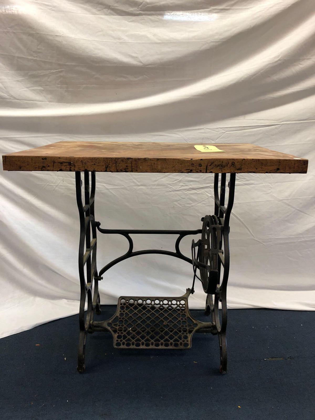 Farmhouse-style table with sewing machine cast-iron base
