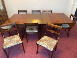 Mahogany Duncan Phyfe style dining table with 8 chairs, 7' long w/ leaves, 38" wide.