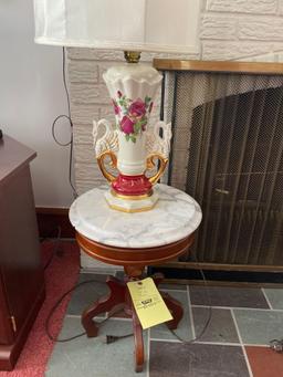 Marble-top stand, table lamp.