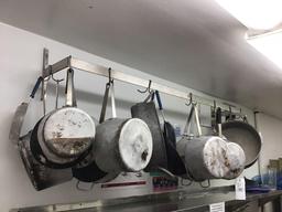 Pot rack with assorted pots and pans. With 10' stainless shelf
