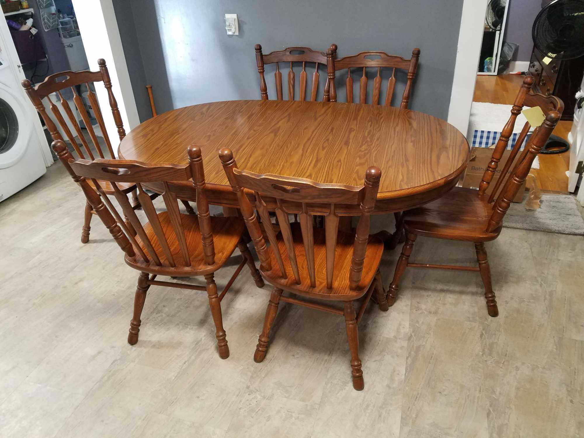 Tell city oak table with formica top, 2 extra leaves and 6 oak chairs