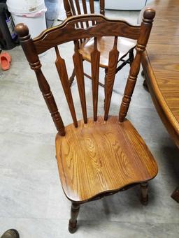 Tell city oak table with formica top, 2 extra leaves and 6 oak chairs