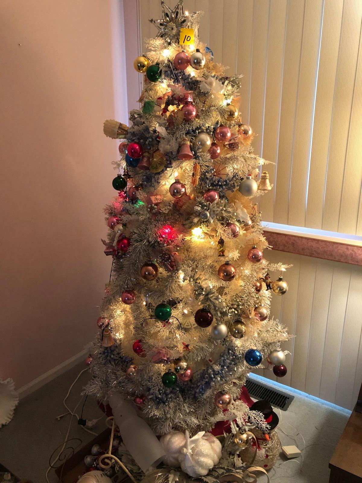 White Christmas tree full of vintage ornaments