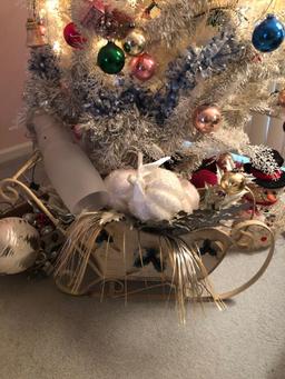 White Christmas tree full of vintage ornaments