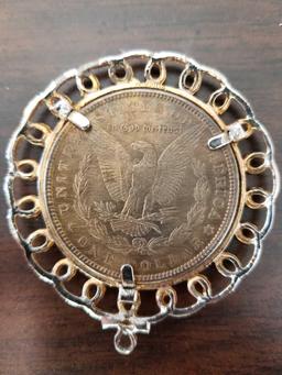 1879 Morgan silver dollar in necklace case