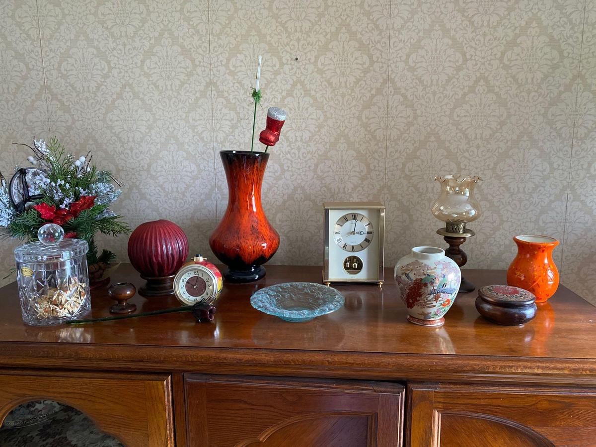 Oak finished TV cabinet with glassware, figurines, and contents