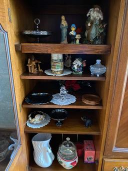 Oak finished TV cabinet with glassware, figurines, and contents