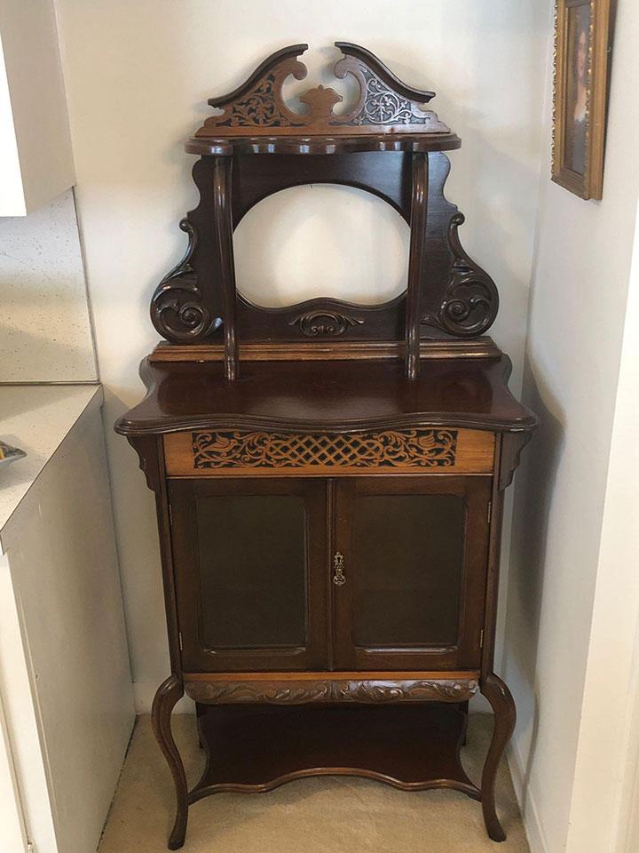 Carved bird scene cabinet