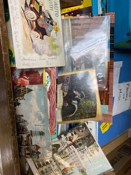 Wooden box with vintage postcards, old postcards some as old as 1900s