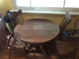 Oak ped table with 4 press back chairs