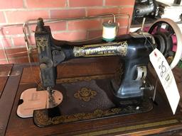 White treadle base sewing machine