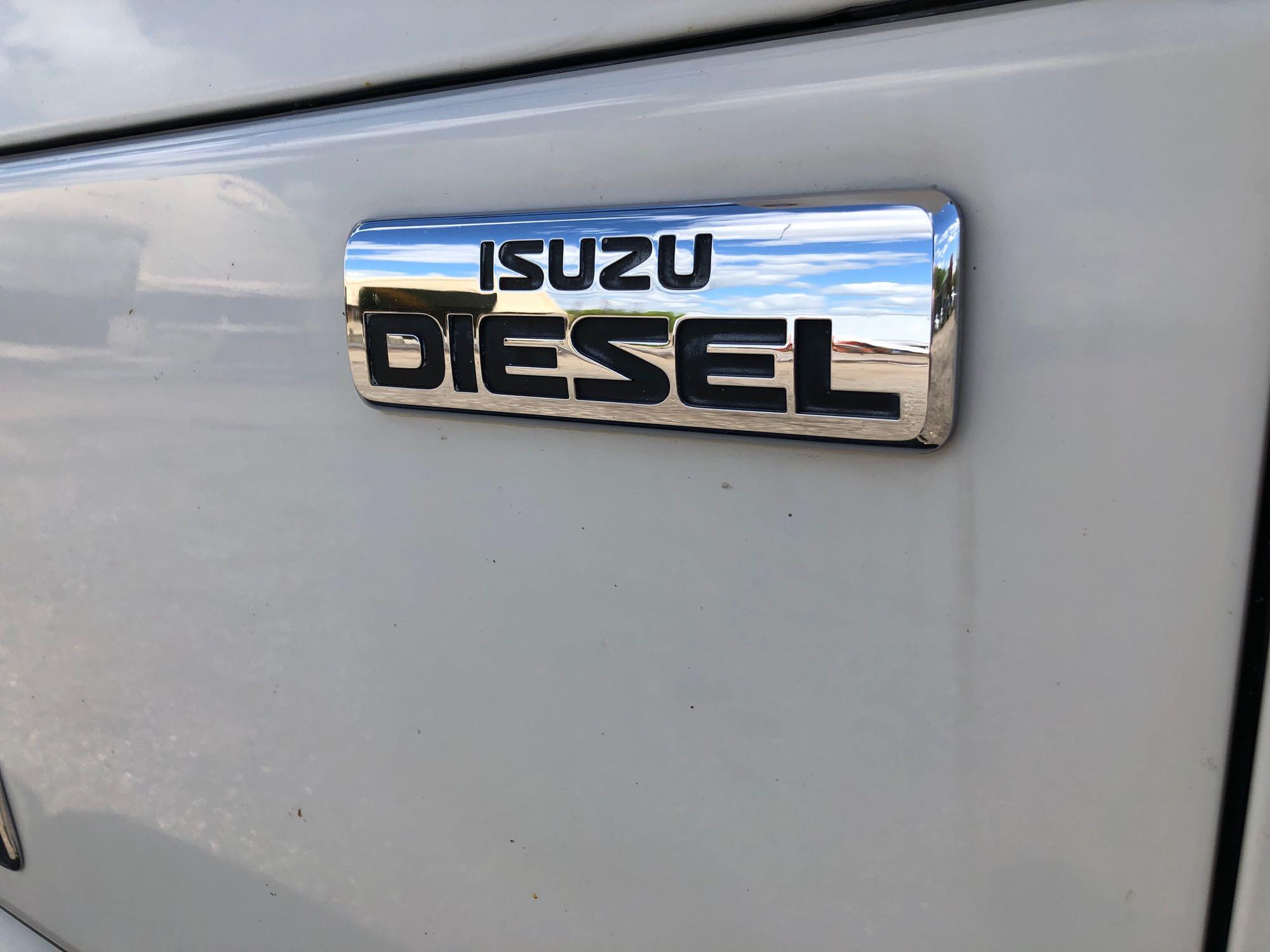 2014 Isuzu cab over diesel flatbed truck with 42,886 miles