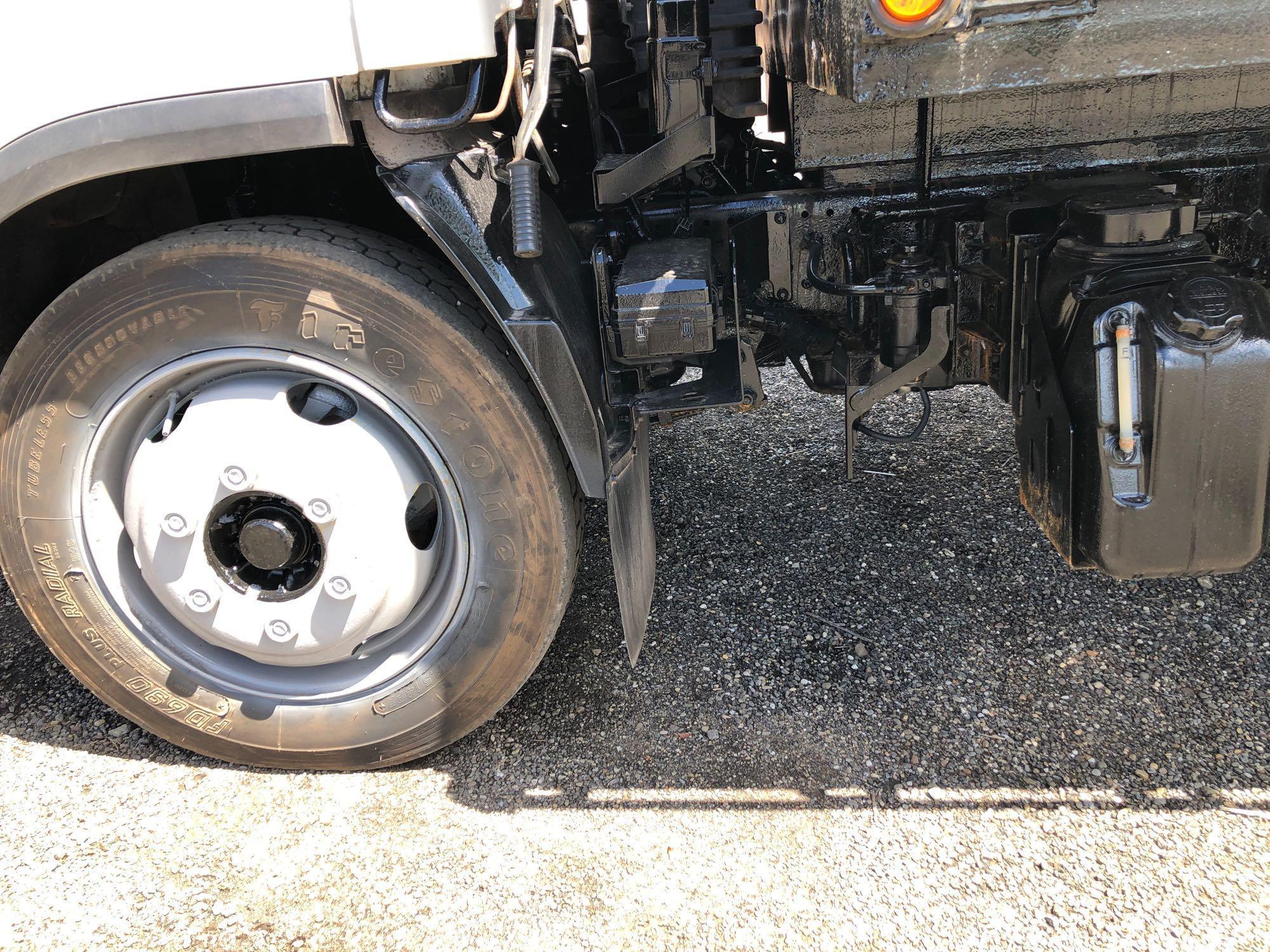 2014 Isuzu cab over diesel flatbed truck with 42,886 miles
