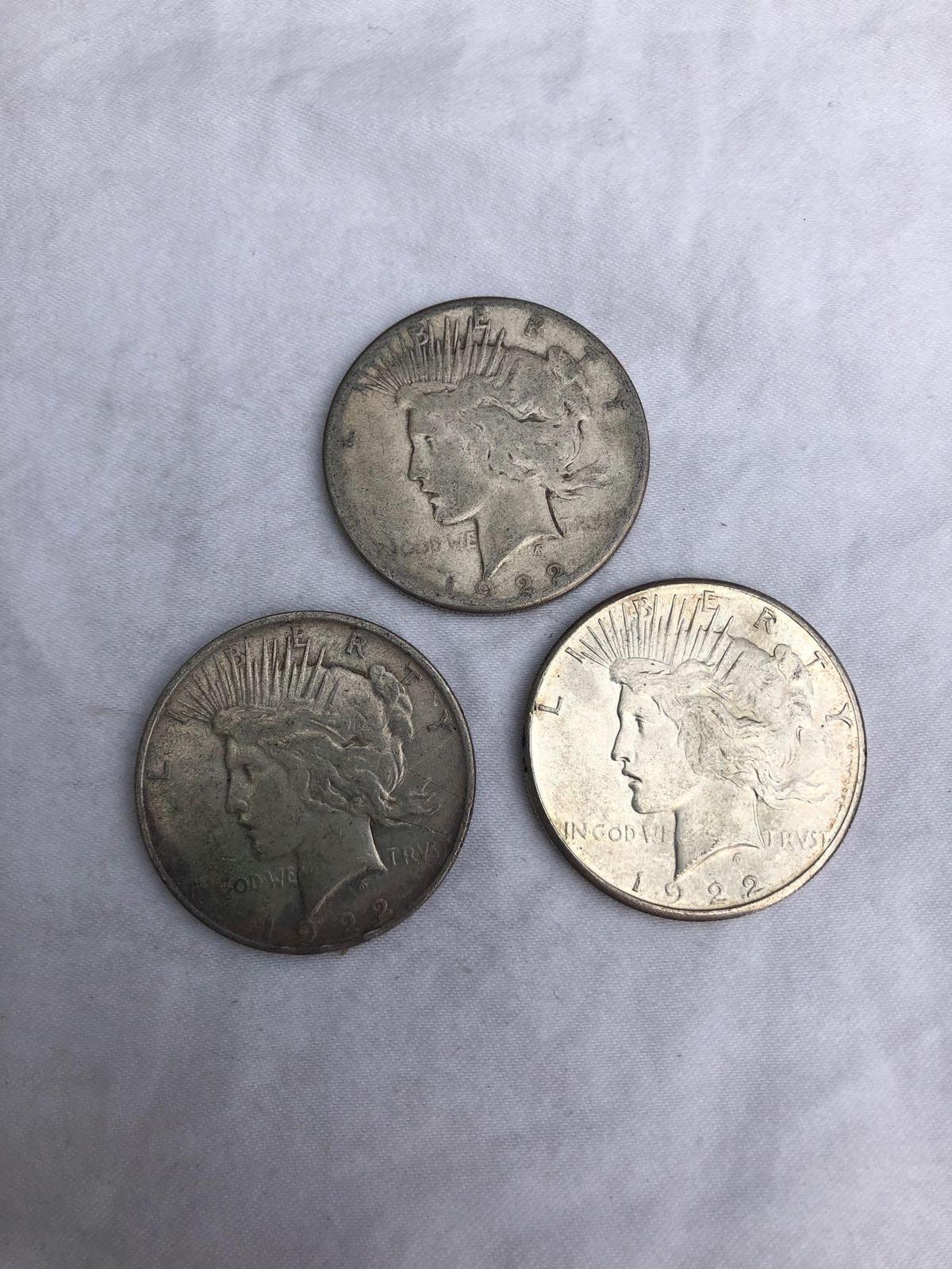 3 Peace silver dollars. All 1922