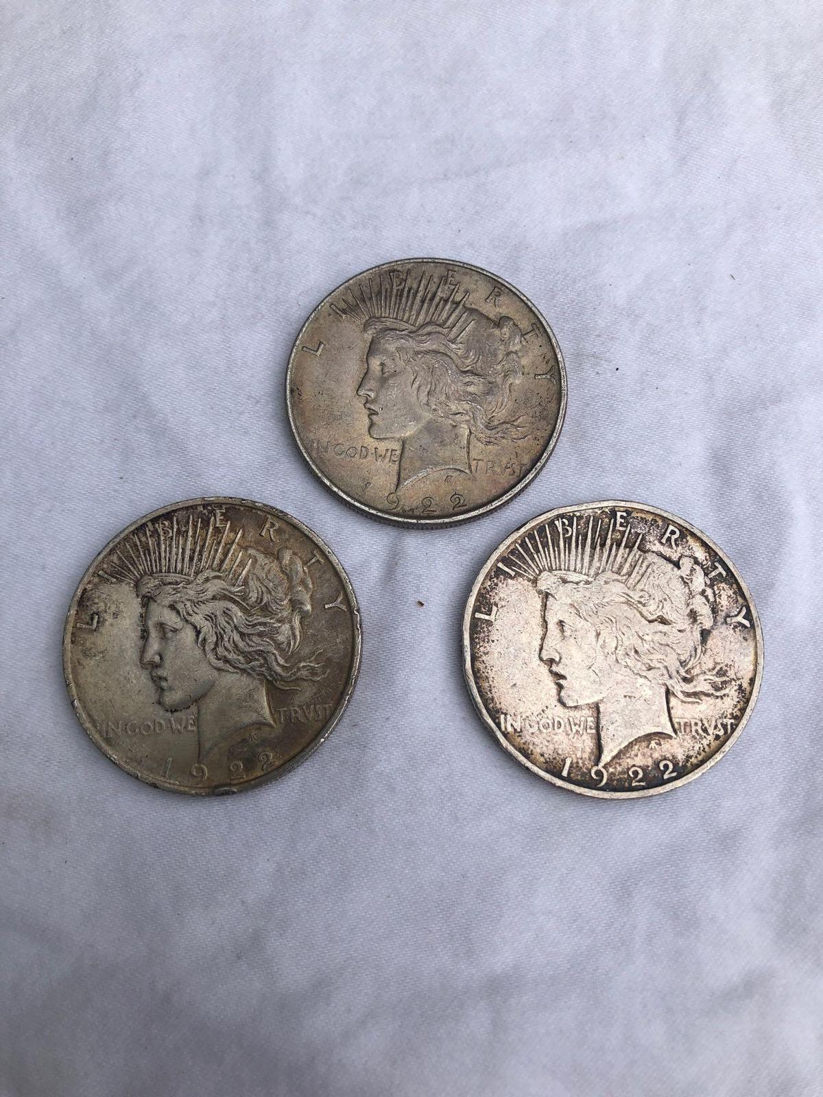 3 Peace silver dollars. All 1922