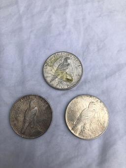 3 Peace silver dollars. All 1922