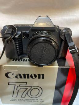 Collection of vintage cameras, Canon T70, Exakta Varex, Nikon auto 35, misc accessories