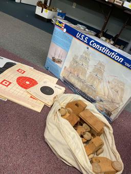 Large USS Constitution model kit, targets, wooden toy trucks