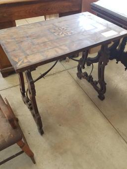 Early inlaid table, metal stretcher
