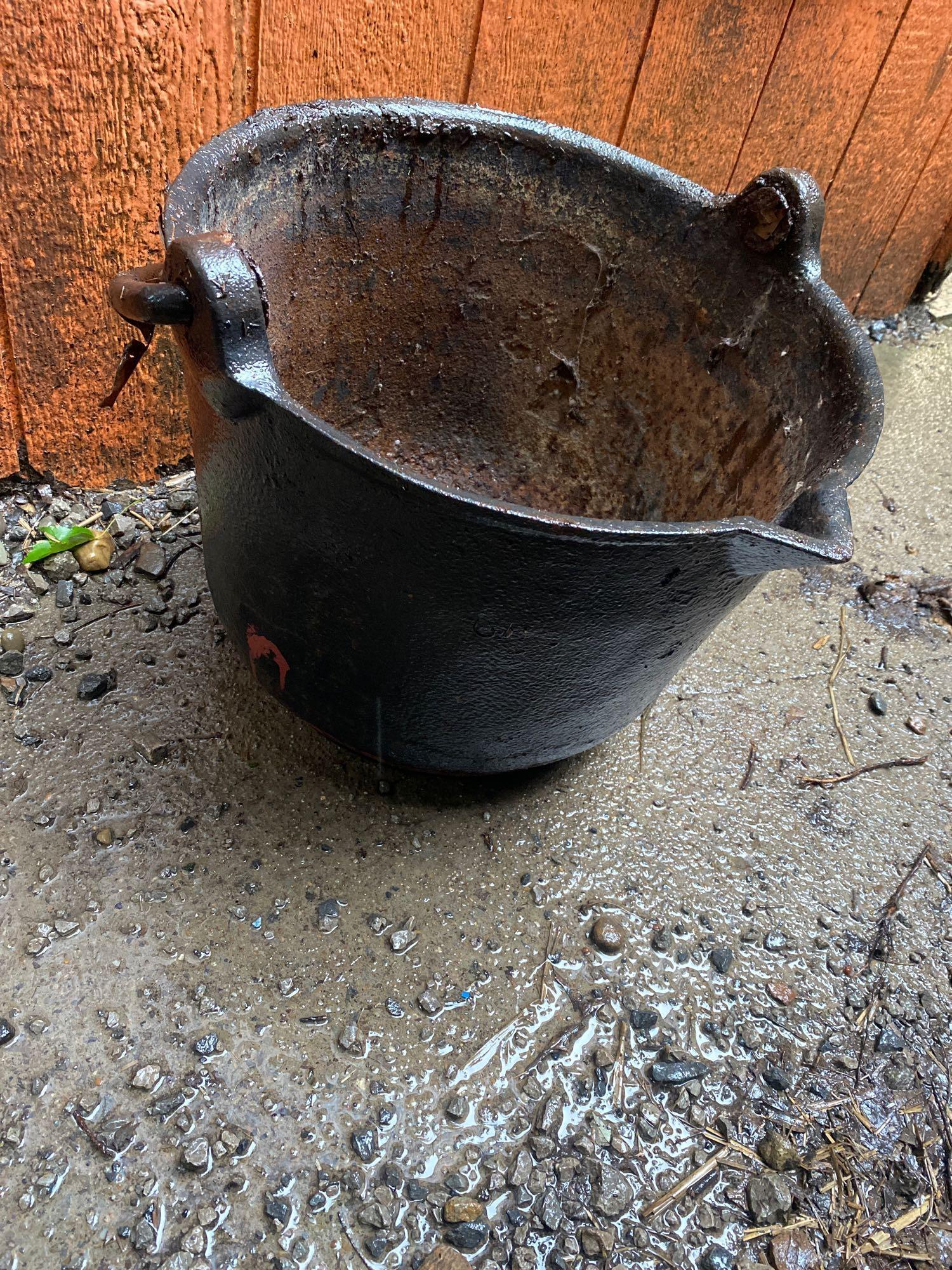Cast iron kettle with handle and spout