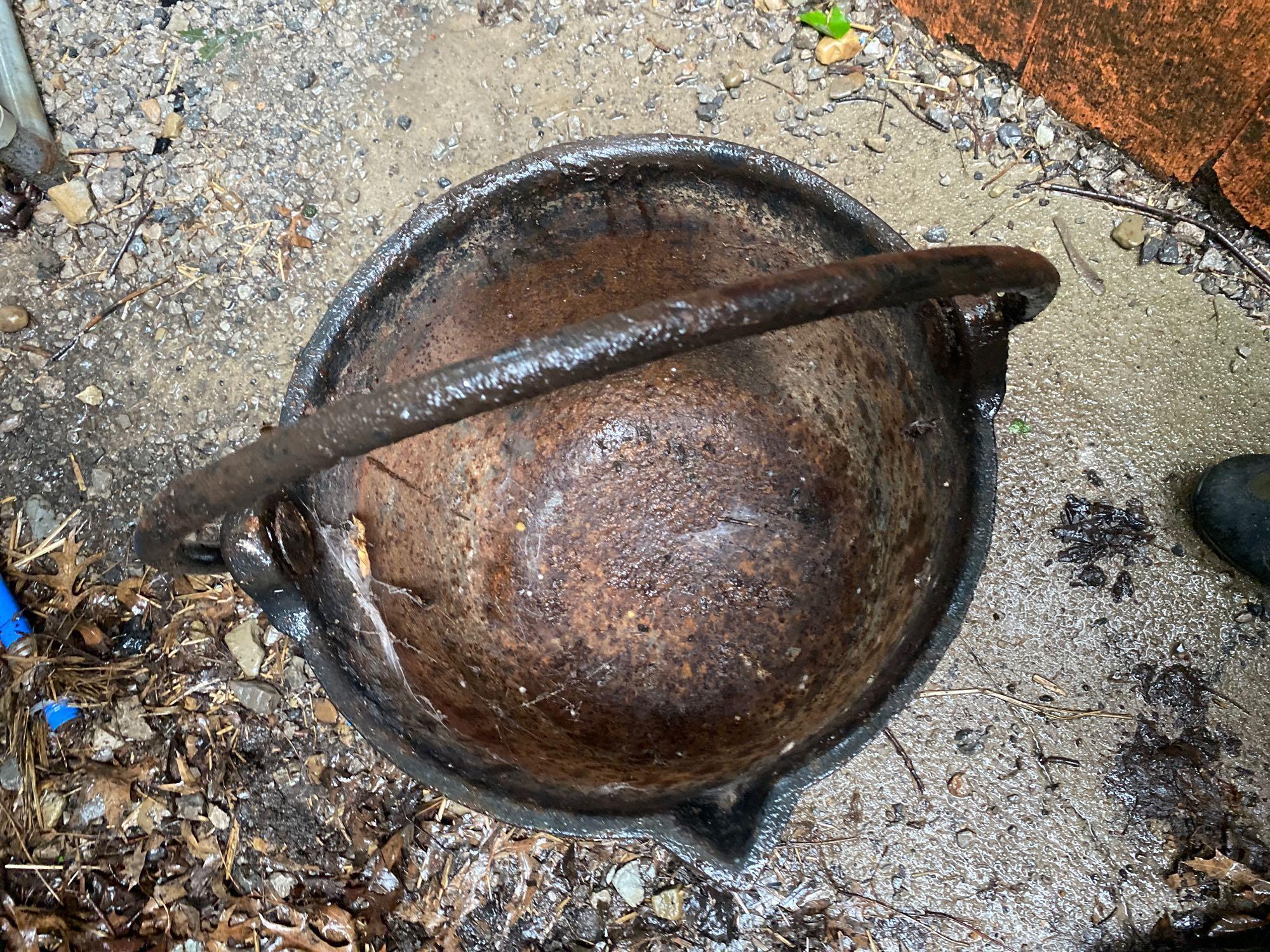 Cast iron kettle with handle and spout