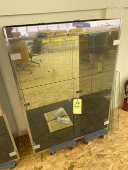 Pair of lighted glass door display cabinets w/ glass shelves.